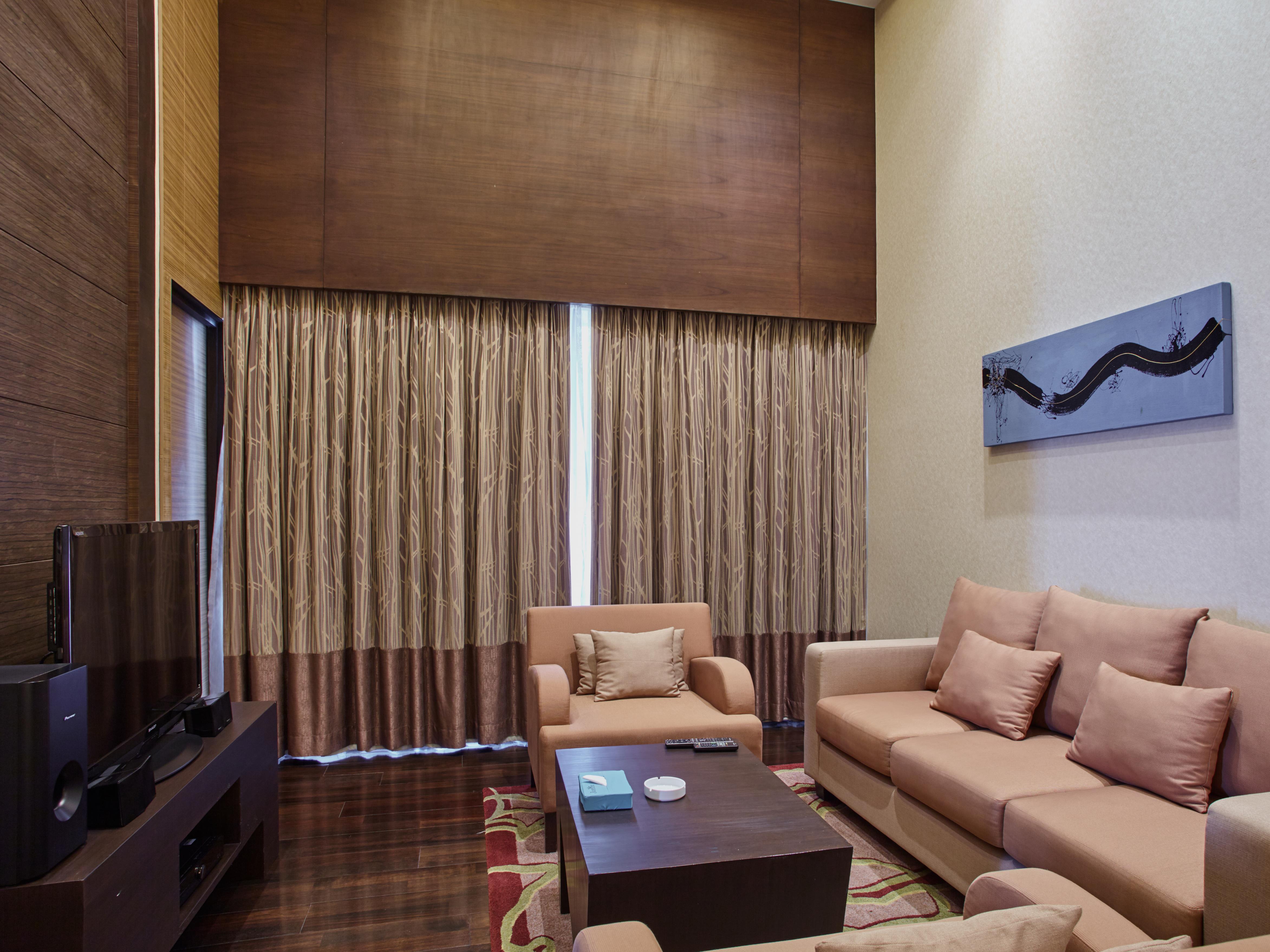 Jasmine Resort Bangkok Exterior photo A living room in a suite at the hotel